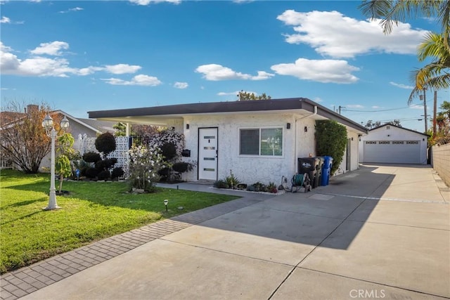 5211 Mcclintock Ave, Temple City, CA 91780 - ranch-style home with a garage, an outdoor structure, stucco siding, and a front yard