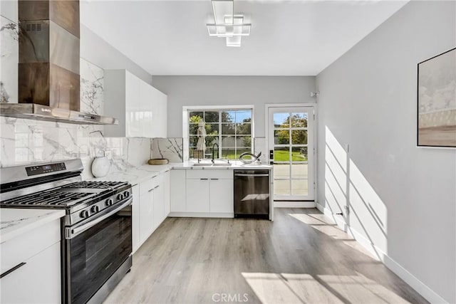 5211 Mcclintock Ave, Temple City, CA 91780 - kitchen featuring appliances with stainless steel finishes, a sink, wall chimney exhaust hood, tasteful backsplash, and modern cabinets