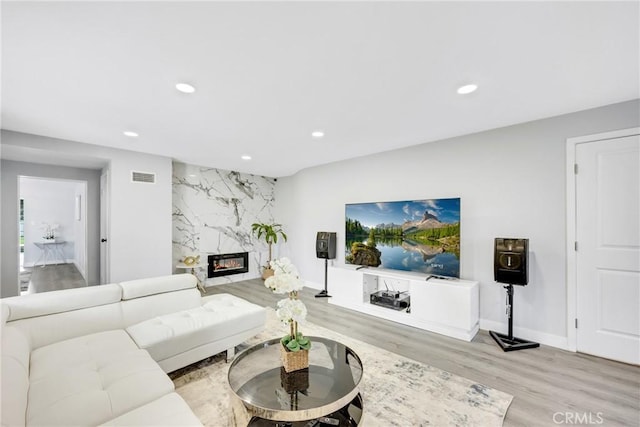 5211 Mcclintock Ave, Temple City, CA 91780 - living area with recessed lighting, baseboards, visible vents, and light wood-type flooring