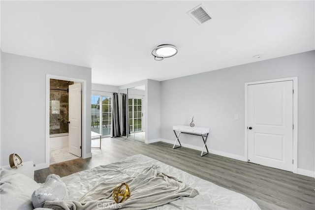 5211 Mcclintock Ave, Temple City, CA 91780 - bedroom with visible vents, connected bathroom, baseboards, and wood finished floors