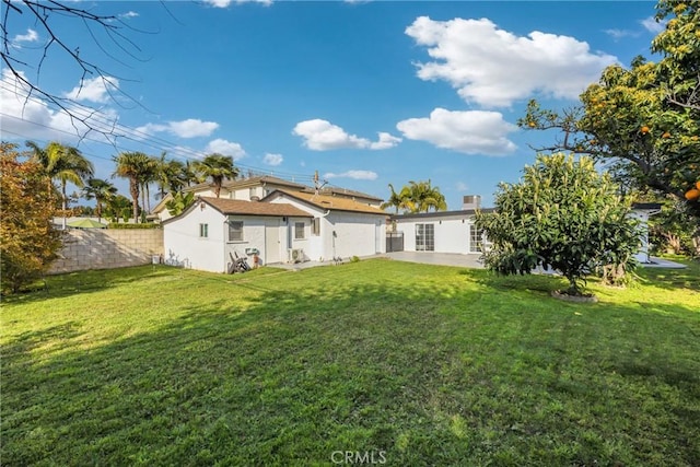 5211 Mcclintock Ave, Temple City, CA 91780 - rear view of property featuring stucco siding, a patio area, fence, and a yard