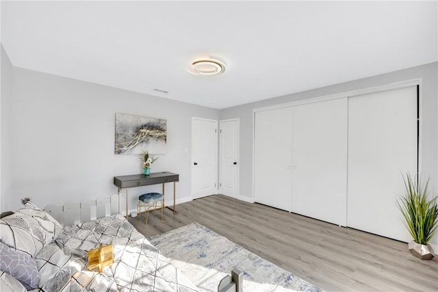 5211 Mcclintock Ave, Temple City, CA 91780 - bedroom featuring baseboards, wood finished floors, and a closet
