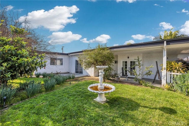 5211 Mcclintock Ave, Temple City, CA 91780 - back of house featuring french doors, stucco siding, and a yard