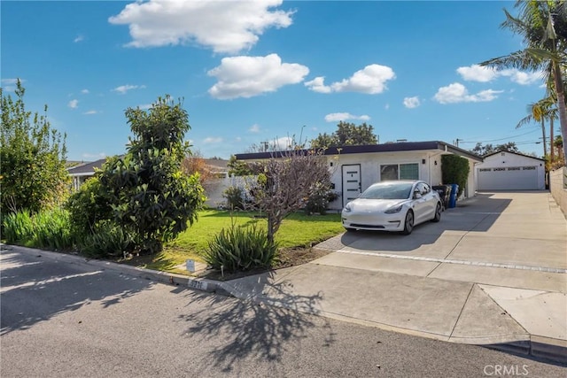5211 Mcclintock Ave, Temple City, CA 91780 - view of front of house featuring stucco siding, a garage, an outbuilding, and a front lawn