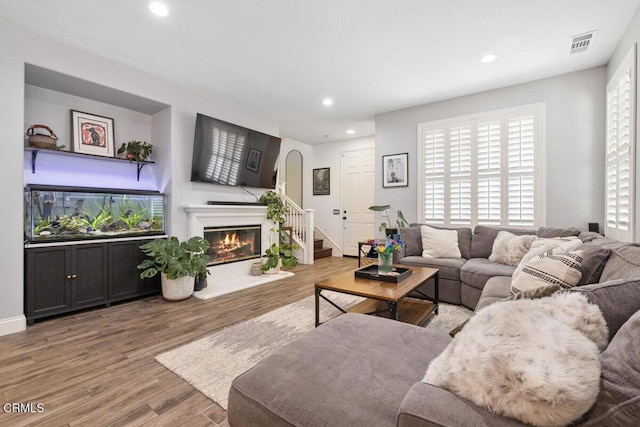 535 Starboard Ln, Port Hueneme, CA 93041 - living room with recessed lighting, a glass covered fireplace, visible vents, wood finished floors, and plenty of natural light