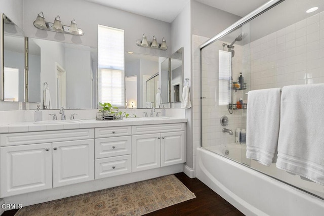 535 Starboard Ln, Port Hueneme, CA 93041 - bathroom featuring shower / bath combination with glass door, wood finished floors, double vanity, and a sink