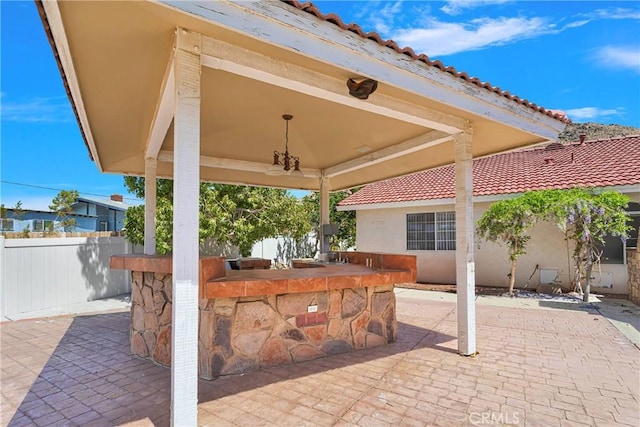 view of patio / terrace with fence and outdoor dry bar