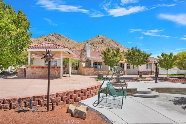 exterior space featuring a patio and a mountain view