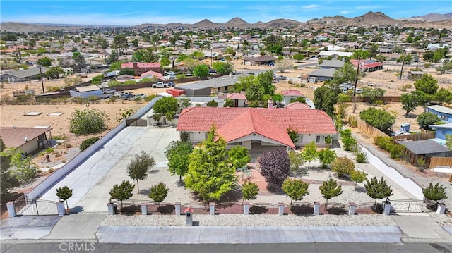 drone / aerial view featuring a residential view and a mountain view