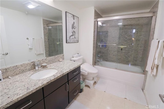 bathroom with enclosed tub / shower combo, toilet, tile patterned flooring, and vanity