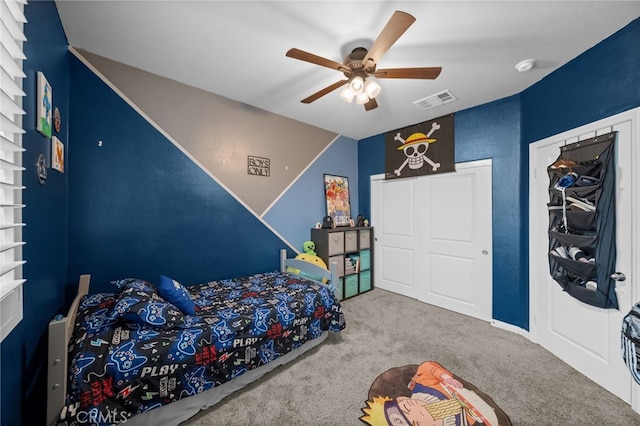 bedroom with visible vents, ceiling fan, and carpet floors