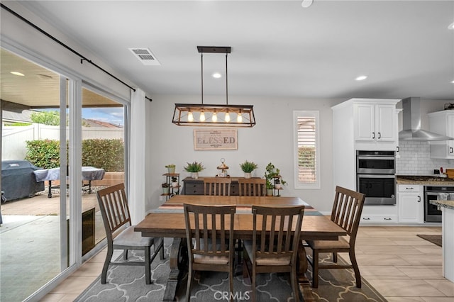 dining room with visible vents and recessed lighting