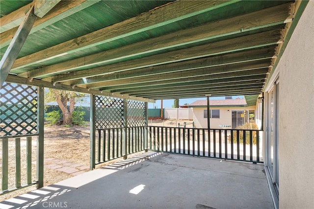 view of patio featuring fence