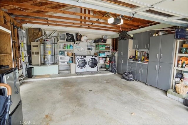 garage featuring a garage door opener, washer and dryer, secured water heater, and heating unit