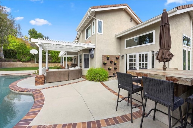 5005 Stonehaven Dr, Yorba Linda, CA 92887 - rear view of property with stucco siding, a patio, outdoor dry bar, outdoor lounge area, and a pergola