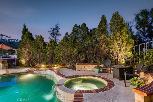 5005 Stonehaven Dr, Yorba Linda, CA 92887 - view of swimming pool with a pool with connected hot tub, a fire pit, outdoor dry bar, and a patio area