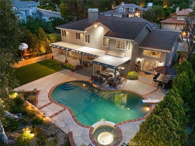 5005 Stonehaven Dr, Yorba Linda, CA 92887 - rear view of house with a chimney, stucco siding, a patio, a tile roof, and an in ground hot tub