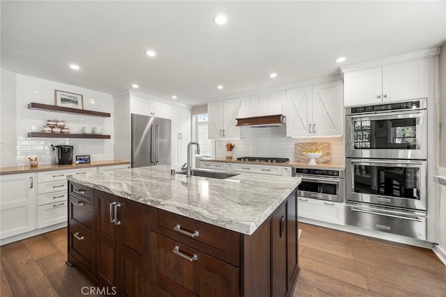 5005 Stonehaven Dr, Yorba Linda, CA 92887 - kitchen featuring decorative backsplash, stainless steel appliances, a warming drawer, a sink, and dark wood-style floors