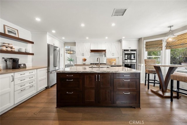 5005 Stonehaven Dr, Yorba Linda, CA 92887 - kitchen featuring backsplash, visible vents, appliances with stainless steel finishes, and dark wood-type flooring