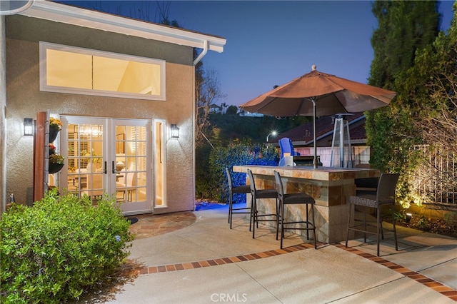 5005 Stonehaven Dr, Yorba Linda, CA 92887 - patio at night featuring french doors and outdoor dry bar