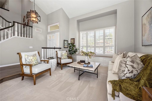 5005 Stonehaven Dr, Yorba Linda, CA 92887 - living area with stairway, a chandelier, carpet flooring, visible vents, and high vaulted ceiling