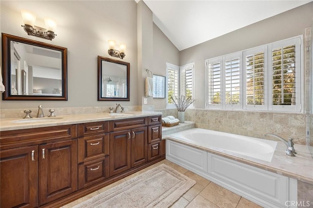 5005 Stonehaven Dr, Yorba Linda, CA 92887 - full bathroom featuring a sink, double vanity, a bath, vaulted ceiling, and tile patterned floors