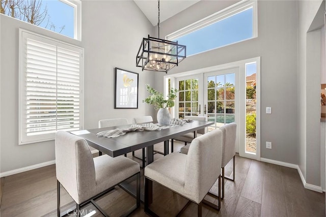 5005 Stonehaven Dr, Yorba Linda, CA 92887 - dining room with a towering ceiling, wood finished floors, a chandelier, and baseboards