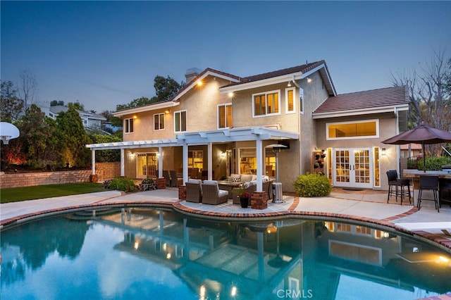 5005 Stonehaven Dr, Yorba Linda, CA 92887 - rear view of property featuring an outdoor hangout area, an outdoor pool, a pergola, stucco siding, and french doors