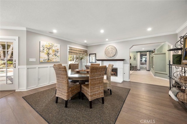 5005 Stonehaven Dr, Yorba Linda, CA 92887 - dining area with recessed lighting, a fireplace, ornamental molding, wainscoting, and wood finished floors