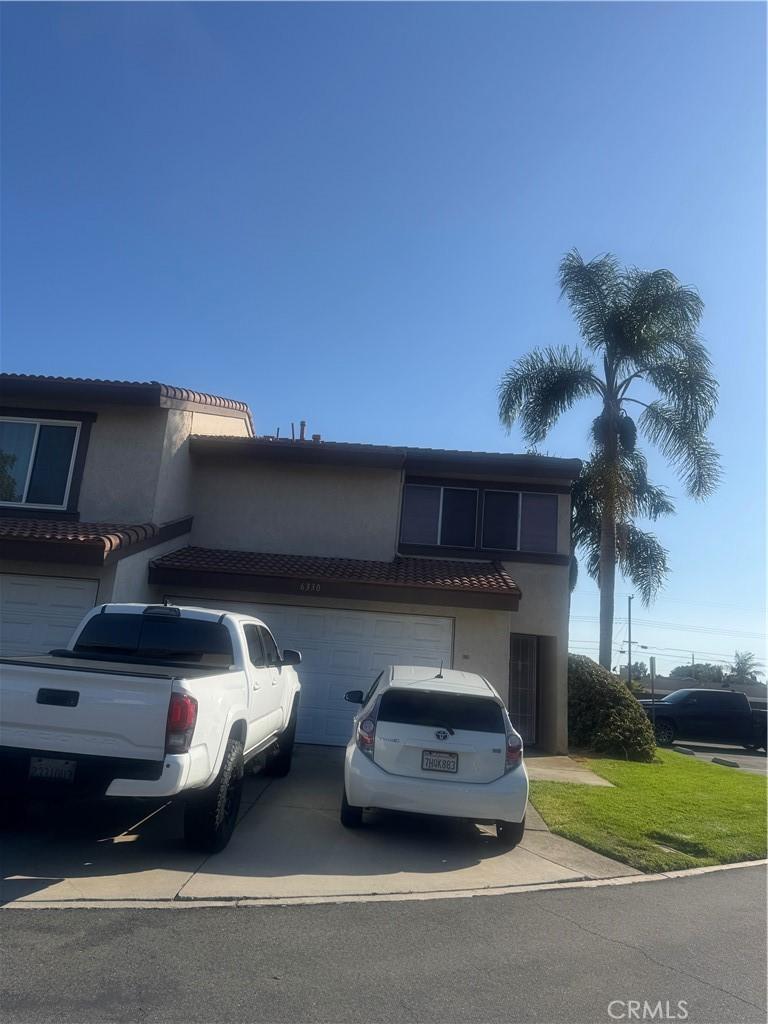 6330 Sonora Way, Cypress, CA 90630 - mediterranean / spanish home featuring concrete driveway, stucco siding, and a garage