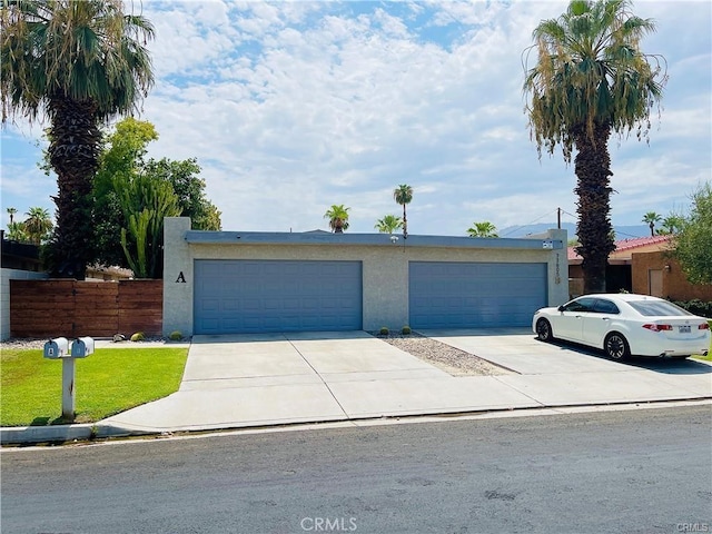 73605 Catalina Way, Palm Desert, CA 92260 - view of front of property with stucco siding, fence, and concrete driveway