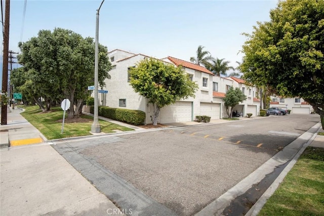 13461 Whittier Ln, Garden Grove, CA 92844 - view of road with traffic signs, sidewalks, curbs, and a residential view