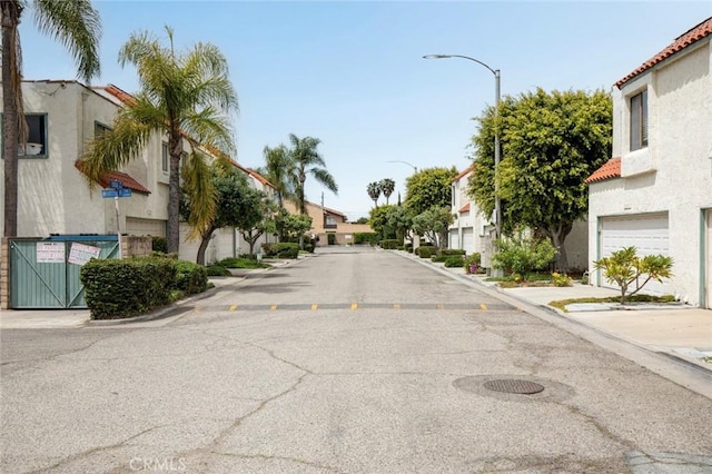 13461 Whittier Ln, Garden Grove, CA 92844 - view of road featuring curbs, street lights, sidewalks, and a residential view