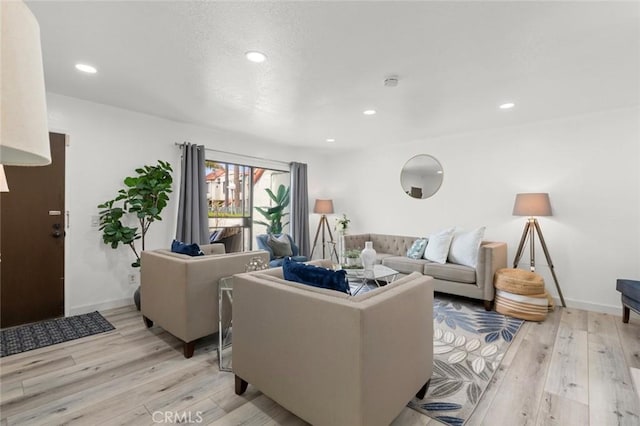 13461 Whittier Ln, Garden Grove, CA 92844 - living room featuring recessed lighting, light wood finished floors, and baseboards