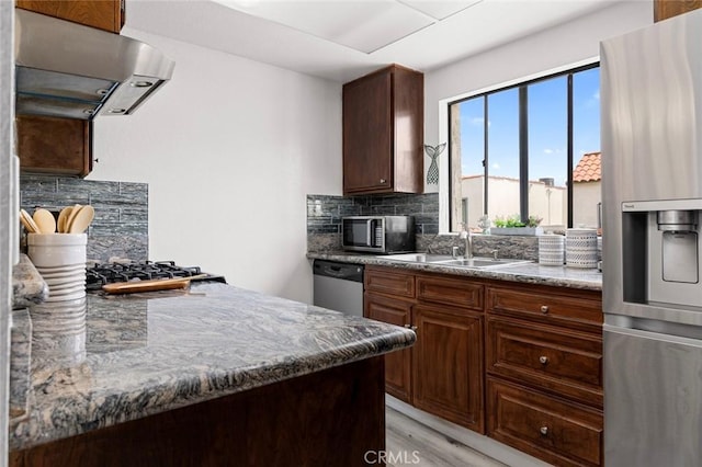 13461 Whittier Ln, Garden Grove, CA 92844 - kitchen featuring decorative backsplash, a sink, light wood finished floors, stainless steel appliances, and extractor fan