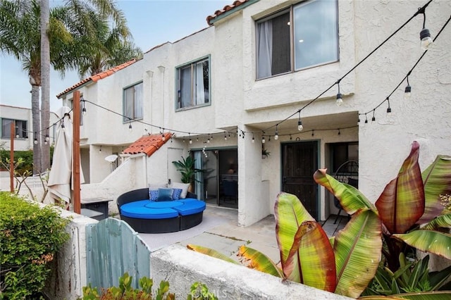 13461 Whittier Ln, Garden Grove, CA 92844 - back of house with fence, stucco siding, a patio area, and a tile roof