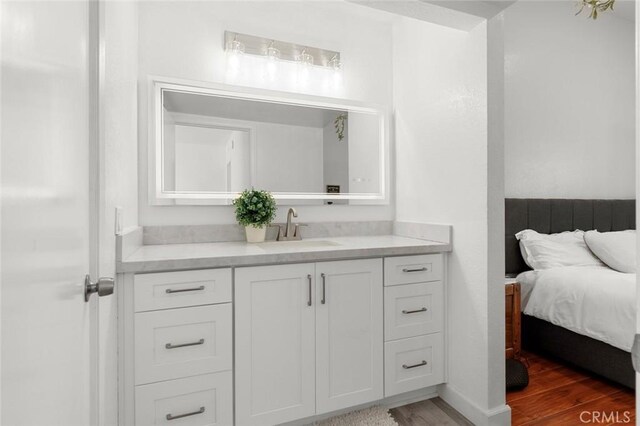 13461 Whittier Ln, Garden Grove, CA 92844 - bathroom featuring vanity and wood finished floors
