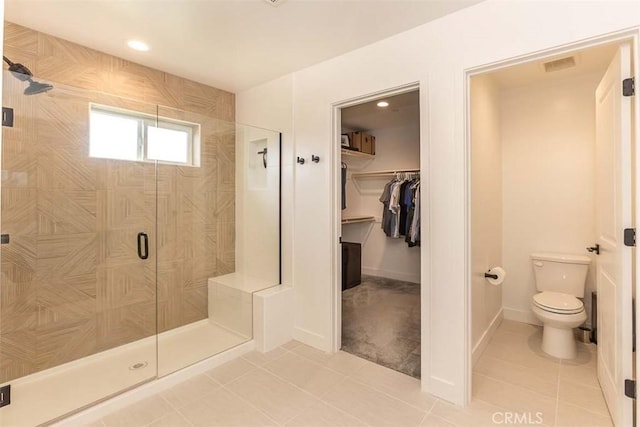 full bath featuring tile patterned floors, visible vents, a stall shower, and toilet