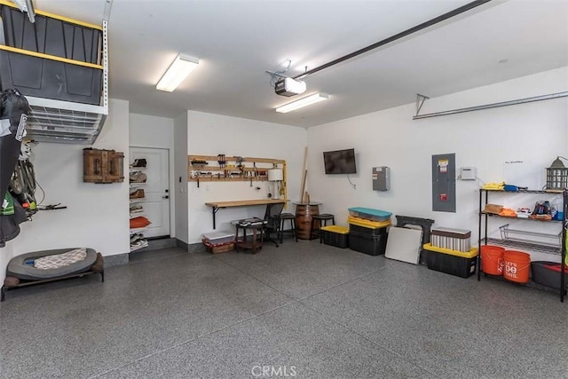 garage featuring electric panel and a garage door opener