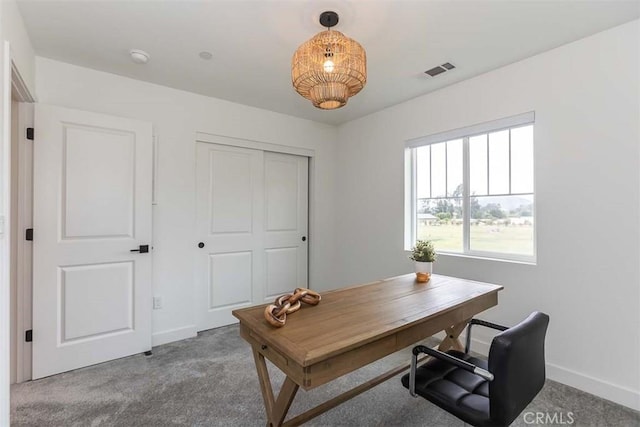 carpeted office with baseboards and visible vents