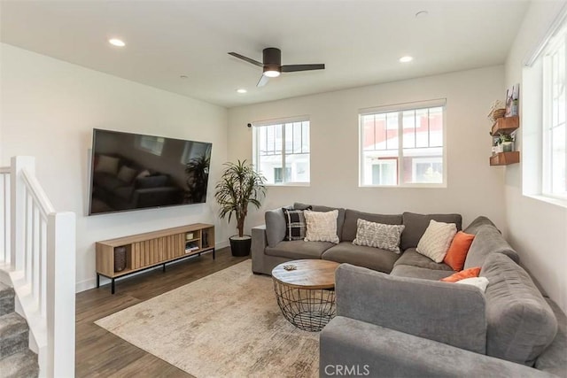 living area with a ceiling fan, wood finished floors, a healthy amount of sunlight, and recessed lighting