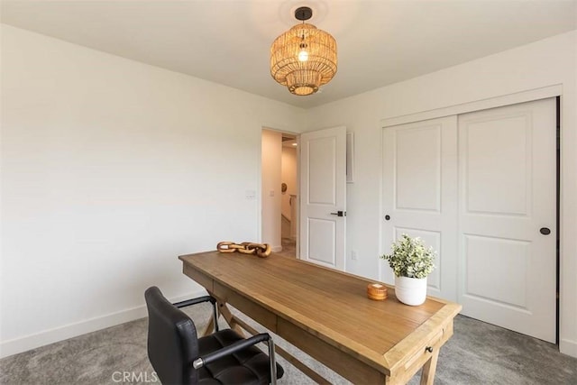 carpeted home office with baseboards