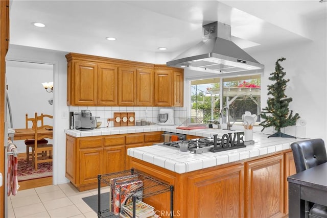 2871 N Wyngate Rd, Orange, CA 92867 - kitchen with tasteful backsplash, a sink, stainless steel gas stovetop, island exhaust hood, and light tile patterned floors