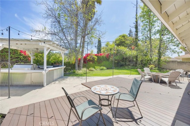 2871 N Wyngate Rd, Orange, CA 92867 - wooden terrace featuring a fenced backyard, a fire pit, exterior kitchen, and a pergola