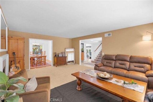 2871 N Wyngate Rd, Orange, CA 92867 - living area with stairs, light colored carpet, visible vents, and a chandelier