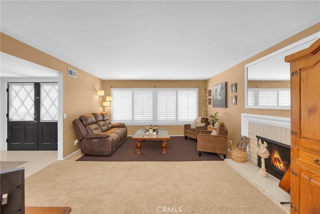 2871 N Wyngate Rd, Orange, CA 92867 - living area featuring carpet flooring, visible vents, plenty of natural light, and a fireplace