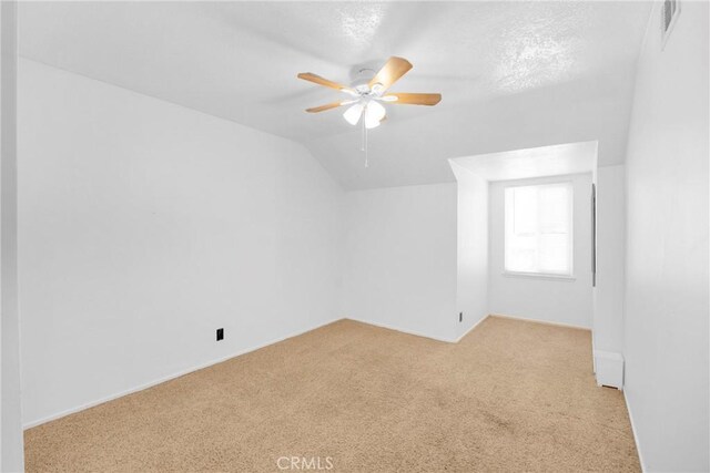 2871 N Wyngate Rd, Orange, CA 92867 - empty room featuring light colored carpet, ceiling fan, lofted ceiling, and visible vents