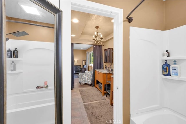 2871 N Wyngate Rd, Orange, CA 92867 - full bath featuring vanity, bathtub / shower combination, a raised ceiling, and a chandelier