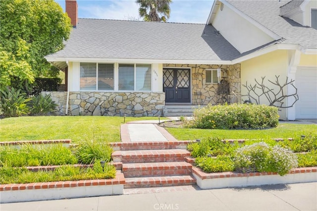 2871 N Wyngate Rd, Orange, CA 92867 - doorway to property featuring a chimney, a yard, a shingled roof, stone siding, and stucco siding