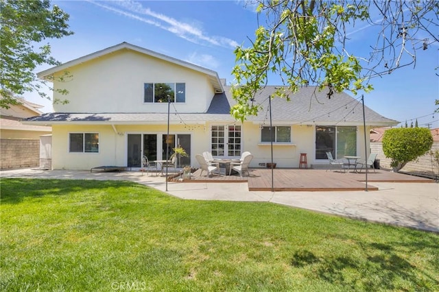 2871 N Wyngate Rd, Orange, CA 92867 - rear view of house featuring fence, a shingled roof, stucco siding, a patio area, and a lawn